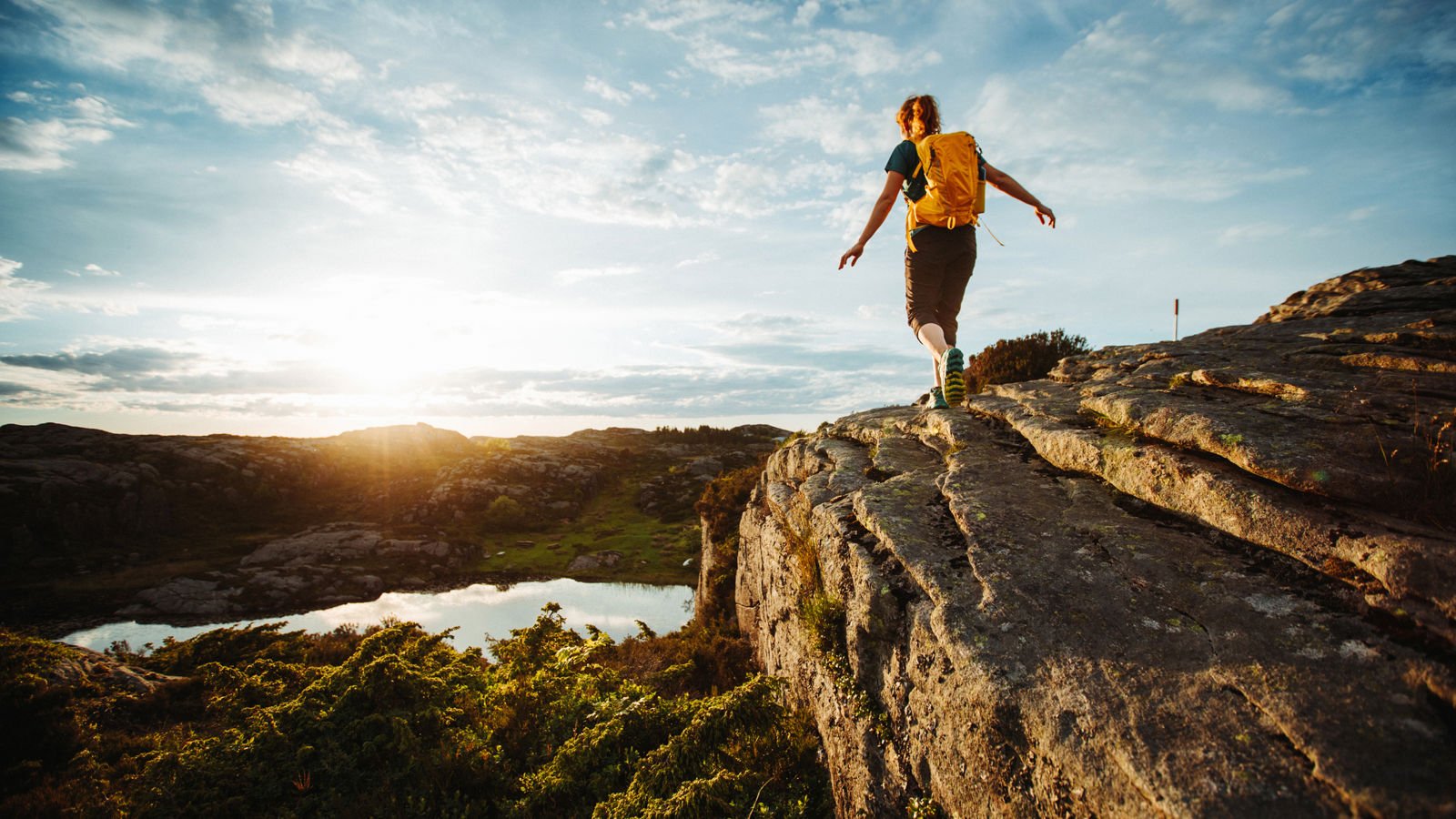 Woman hiking in sunny weather 