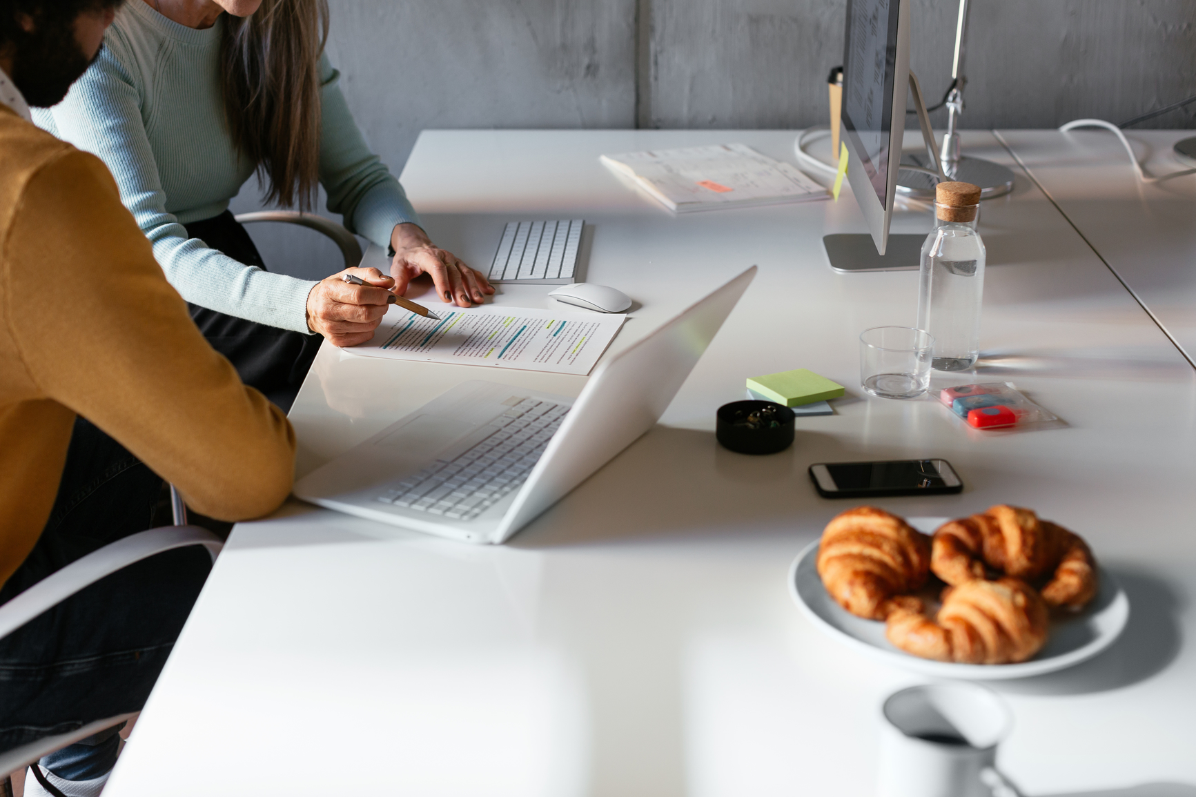 Two people working together on a document