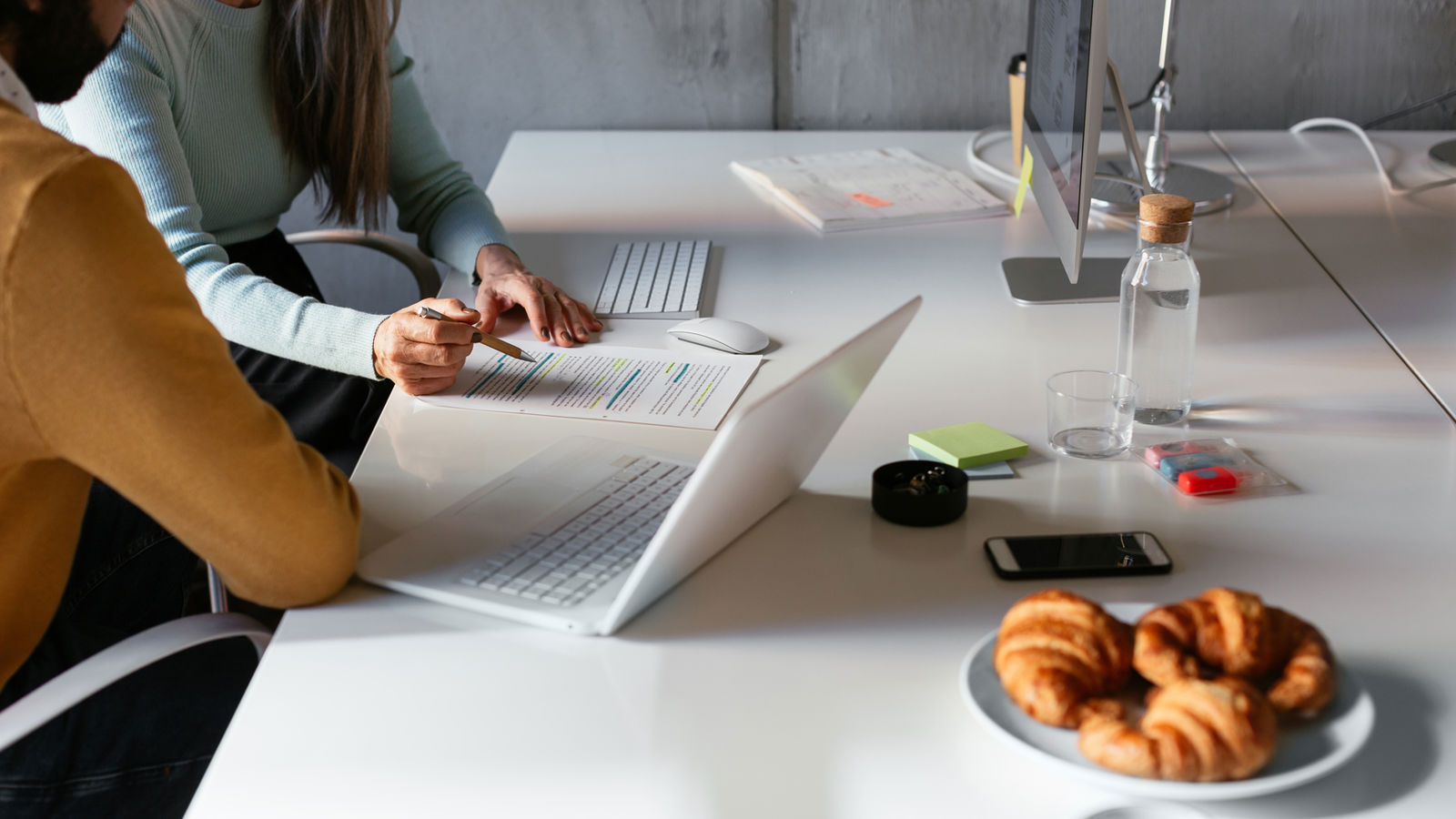 Two people working together on a document