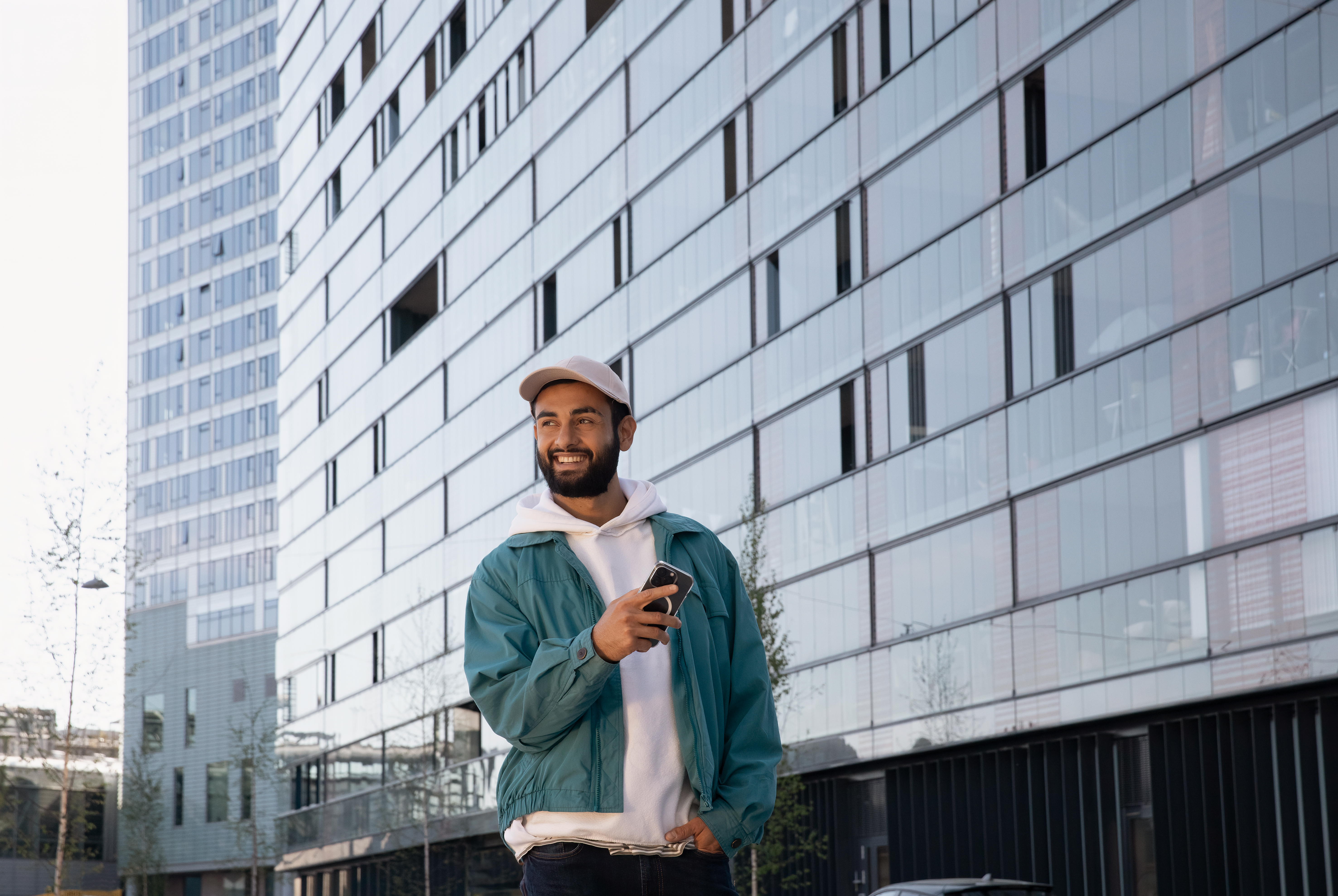 Woman showing a document to two people sitting by a desk