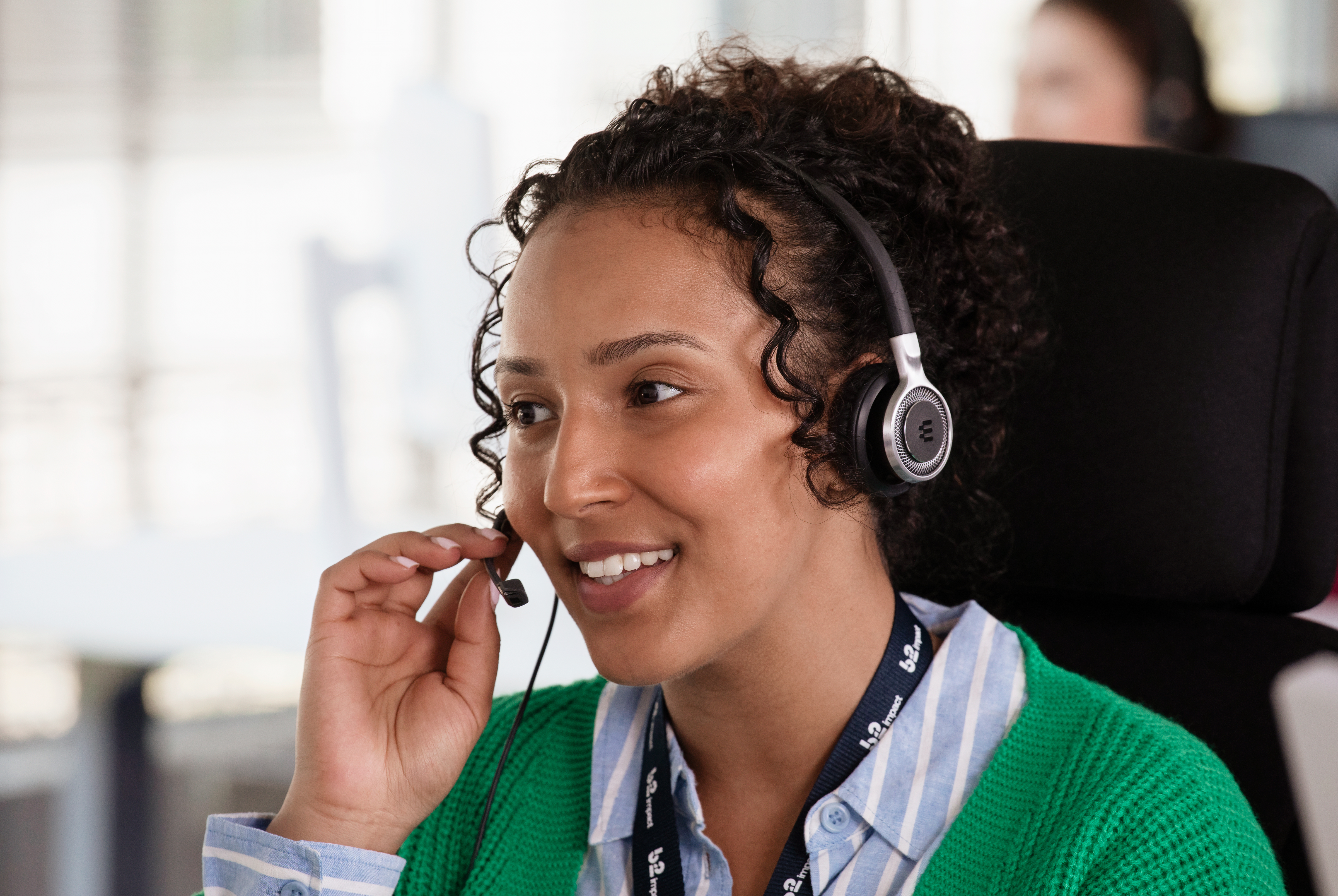 Woman talking on the phone in an office environment